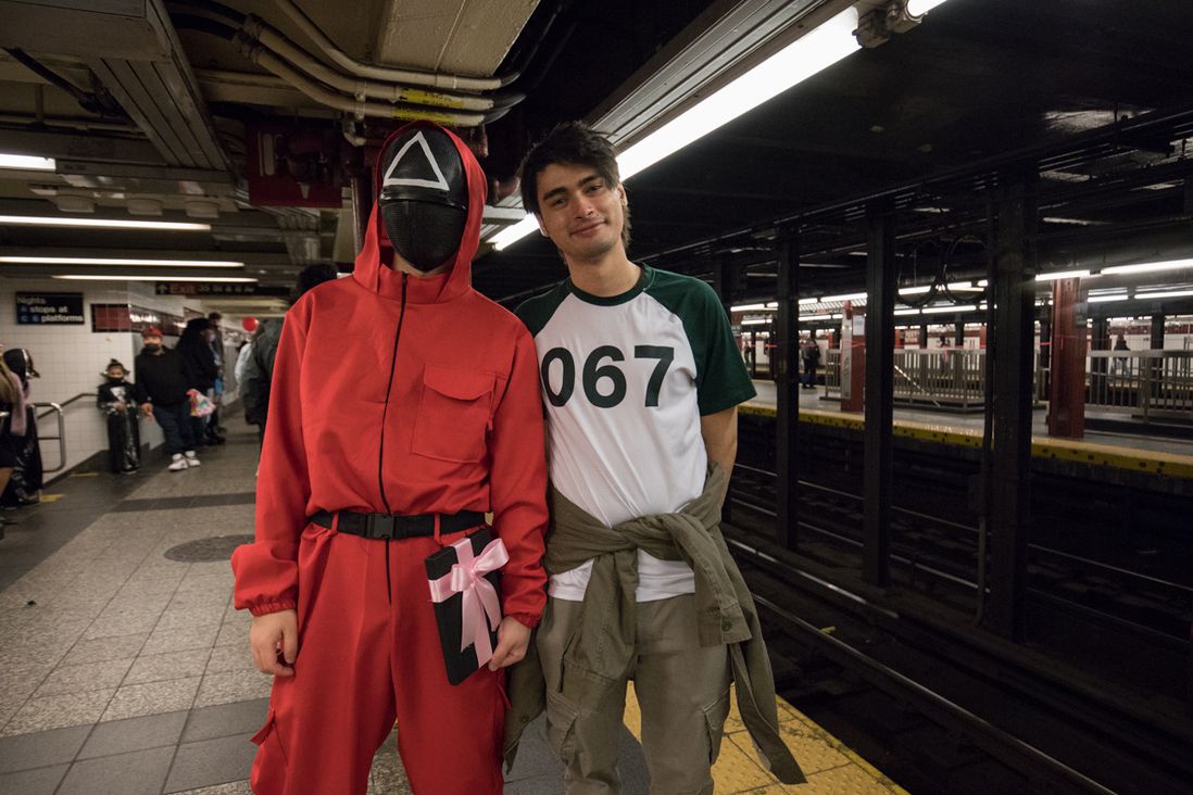 Photos of people dressed up in costumes on the subway for Halloween 2021